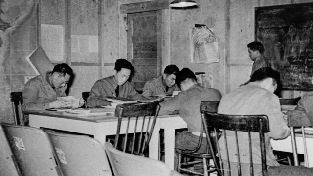 Historical black and white photo of Japanese american soldiers studying at the Military Intelligence Service Language School at Crissy Field, 1941-1942