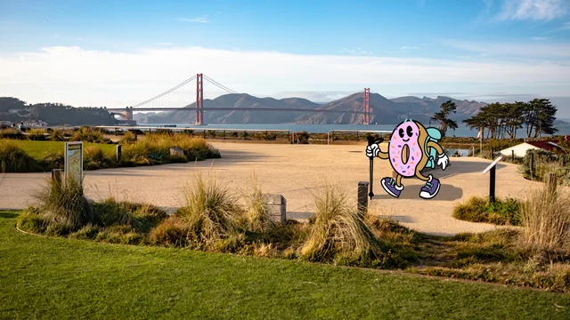 a scenic view from the Presidio Tunnel Tops in San Francisco, with a cartoon donut hiking along as part of the Golden Gate Dozen Trail