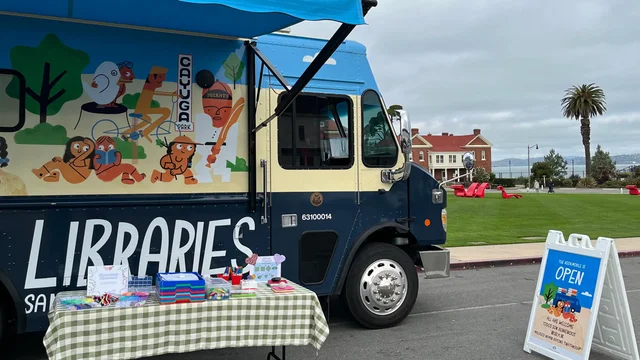 The San Francisco Public Library's SummerMobile parked at the Presidio Main Lawn.