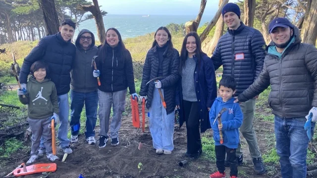 Volunteers take a break and smile for the camera at Lands End.