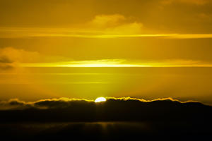 Sun breaking through storm clouds