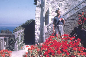 An Alcatraz incarcerated gardener stands in Officers' Row