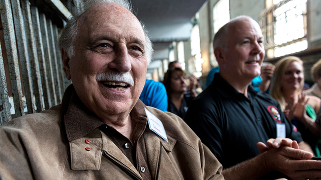 Former Alcatraz guard George DeVincenzi and other alumni participate in a reunion on the island in 2015.