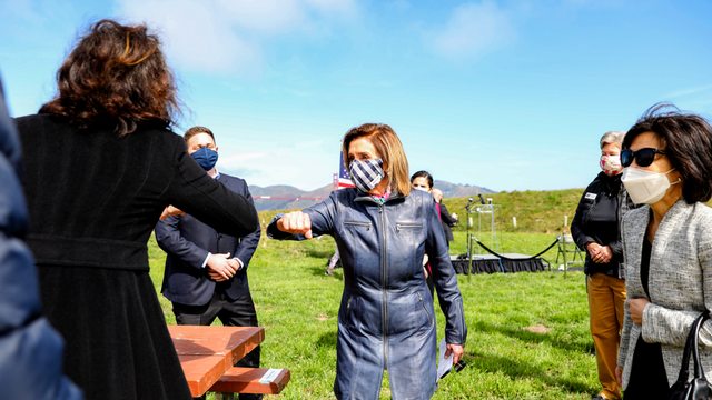 Speaker Nancy Pelosi elbow bumps to greet attendees at Crissy Field's 20th anniversary address