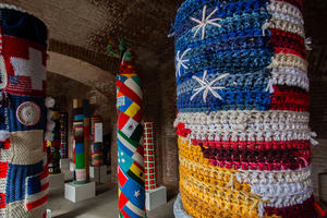 Pole surrounded by a knitted American flag at Fort Point National Historic Site