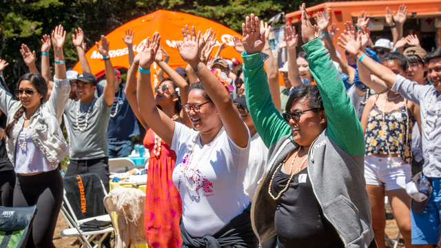 People raising hands in the air
