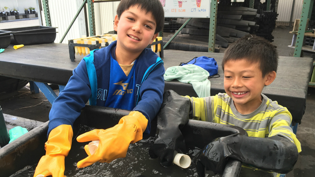 Young people help wash pots