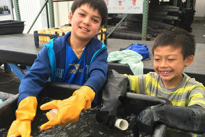 Young people help wash pots