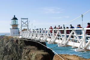 Visitors cross the bridge to Point Bonita Light