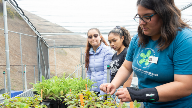 Students check on plants at the Oceana High School Nursery
