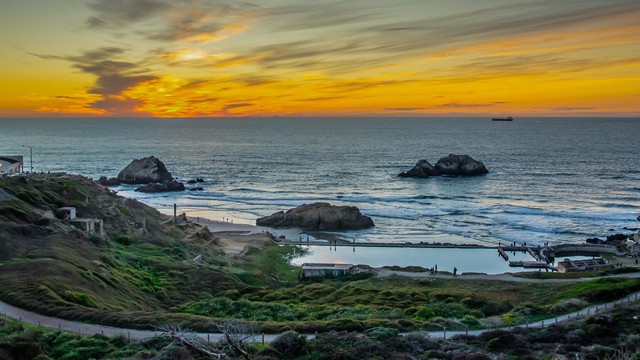 Colors of sunset wash over Sutro Baths