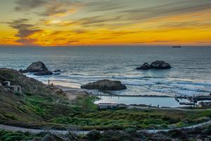 Colors of sunset wash over Sutro Baths