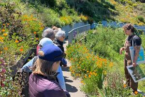 Natalie Korengold leading Parks Conservancy members through a tour of the gardens