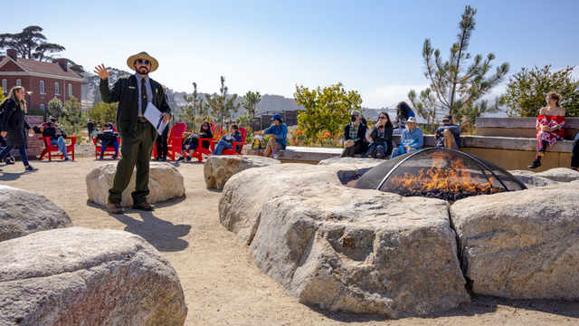 NPS Park Ranger gives a presentation to visitors at the Presidio Campfire Circle