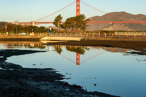 Golden Gate Bridge reflecting in Quartermaster Reach saltwater marsh