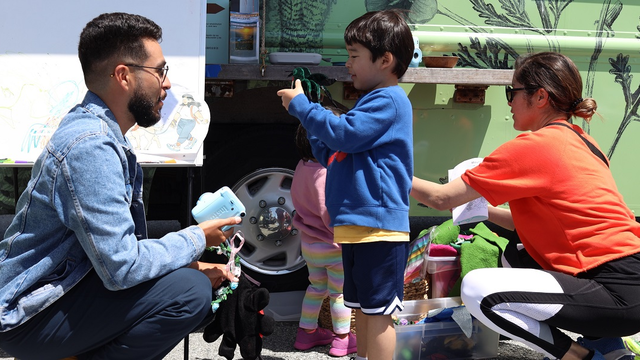 Child learning about nature with the Roving Ranger.