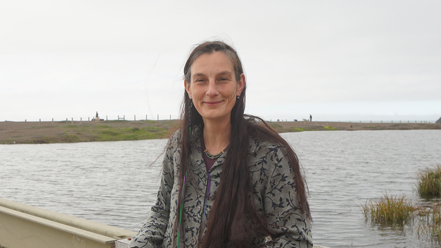 Portrait of Data manager Lizzy Edson smiling on the bridge by Rodeo Lagoon.