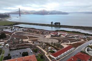 In progress shot of the Presidio Tunnel Tops with the Golden Gate Bridge visible in the background.