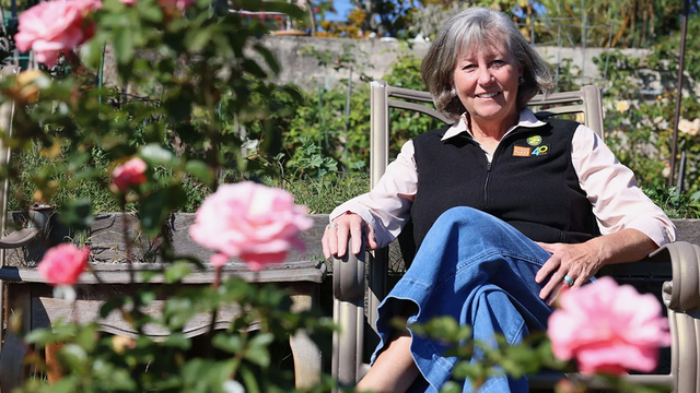Parks Conservancy CEO Chris Lehnertz sits in the Fort Mason Community Garden