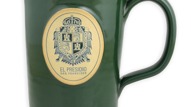 Dark green mug with the Presidio US Army coat of arms