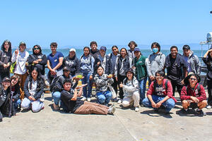 A group of Crissy Field Center youth leadership program members at the docks of Alcatraz Island.