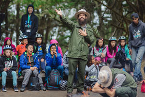 A national park ranger engages the youth
