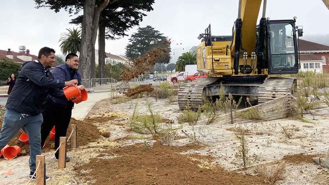 Tossing dirt during the Tunnel Tops "Groundmaking" event.