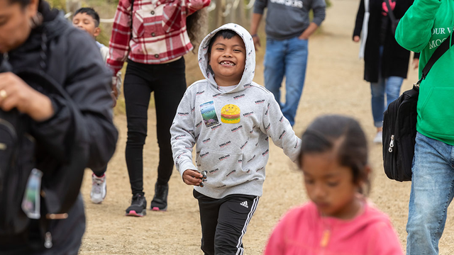 Participants from ALAS (Ayundando Latinos A Soñar) enjoying the "Raíces en la Bahía/Rooted in the Bay" event for farmworkers and their families in September 2024. Activities included crabbing, hiking, and beachside recreation.