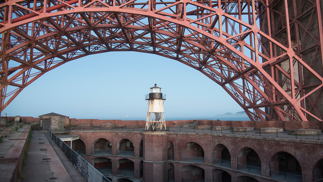 The arch of the Golden Gate bridge over Fort Point.