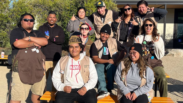 A group of Adventure Guides gather for a photo at the Presidio Tunnel Tops in the San Francisco Bay Area.