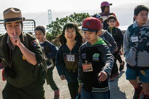 Ranger Kelsi Ju leads a class of students in the Marin Headlands