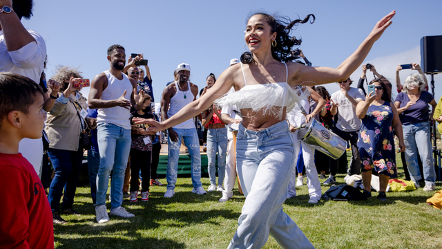 A dancer dances amongst the crowd at the Presidio Tunnel Tops.