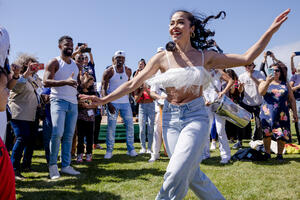 A dancer dances amongst the crowd at the Presidio Tunnel Tops.