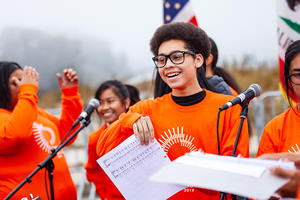 High School students sing in youth choir at Presidio Tunnel Tops ground-making ceremony.