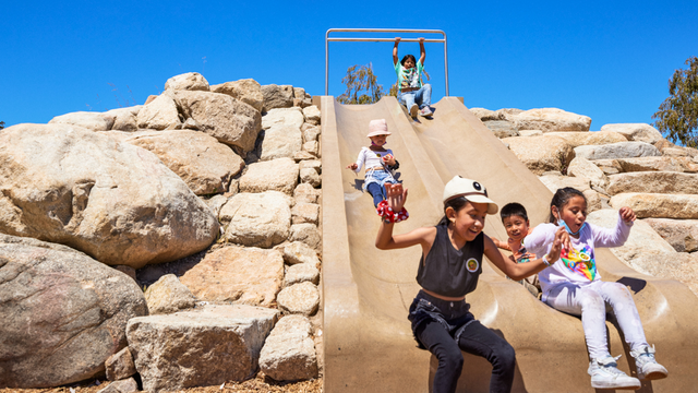 Kids at play having fun on the slide at the Presidio Tunnel Tops Outpost