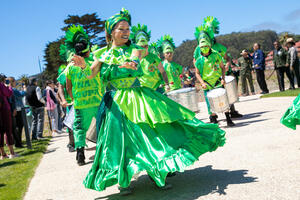 Fogo Na Roupa dancers and band parade throughout the Presidio Tunnel Tops.