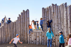 Kids at play on the climbing wall of The Outpost at Presidio Tunnel Tops.