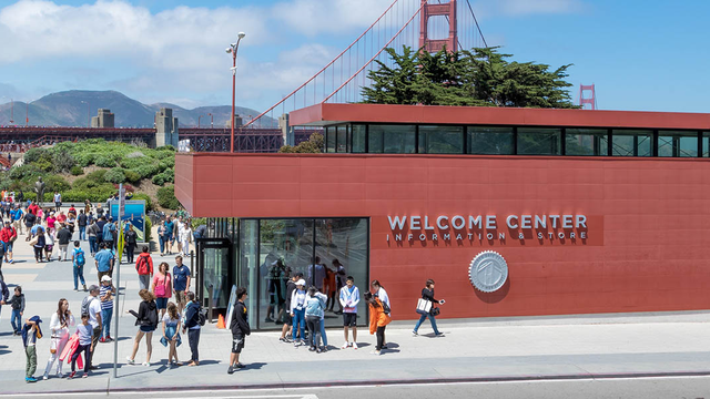 Crowds of people outside the Welcome Center on a beautiful, sunny day
