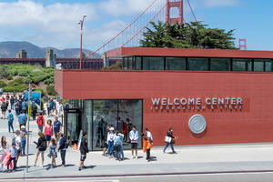 Crowds of people outside the Welcome Center on a beautiful, sunny day