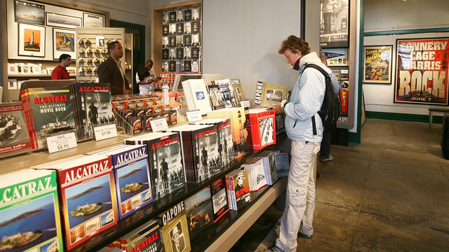 Customer looking at a Capone book in an Alcatraz Island store