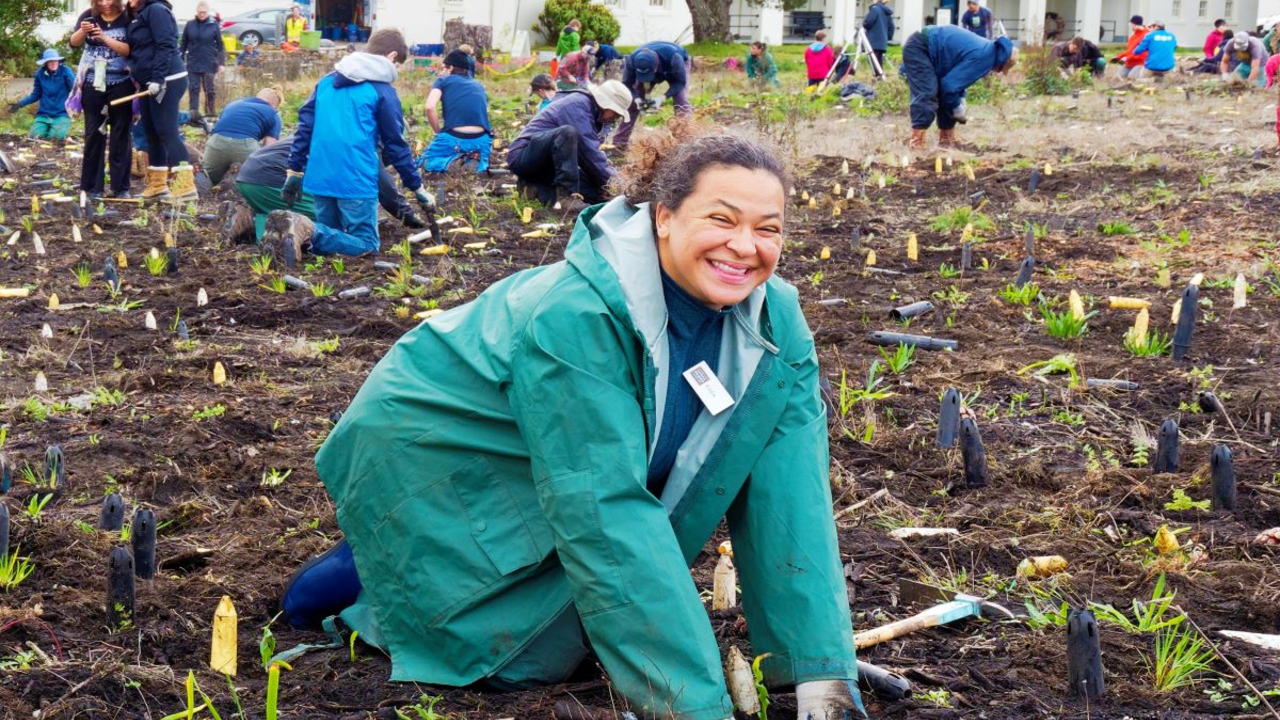 A participant gives a big smile during Presidio Planting Day