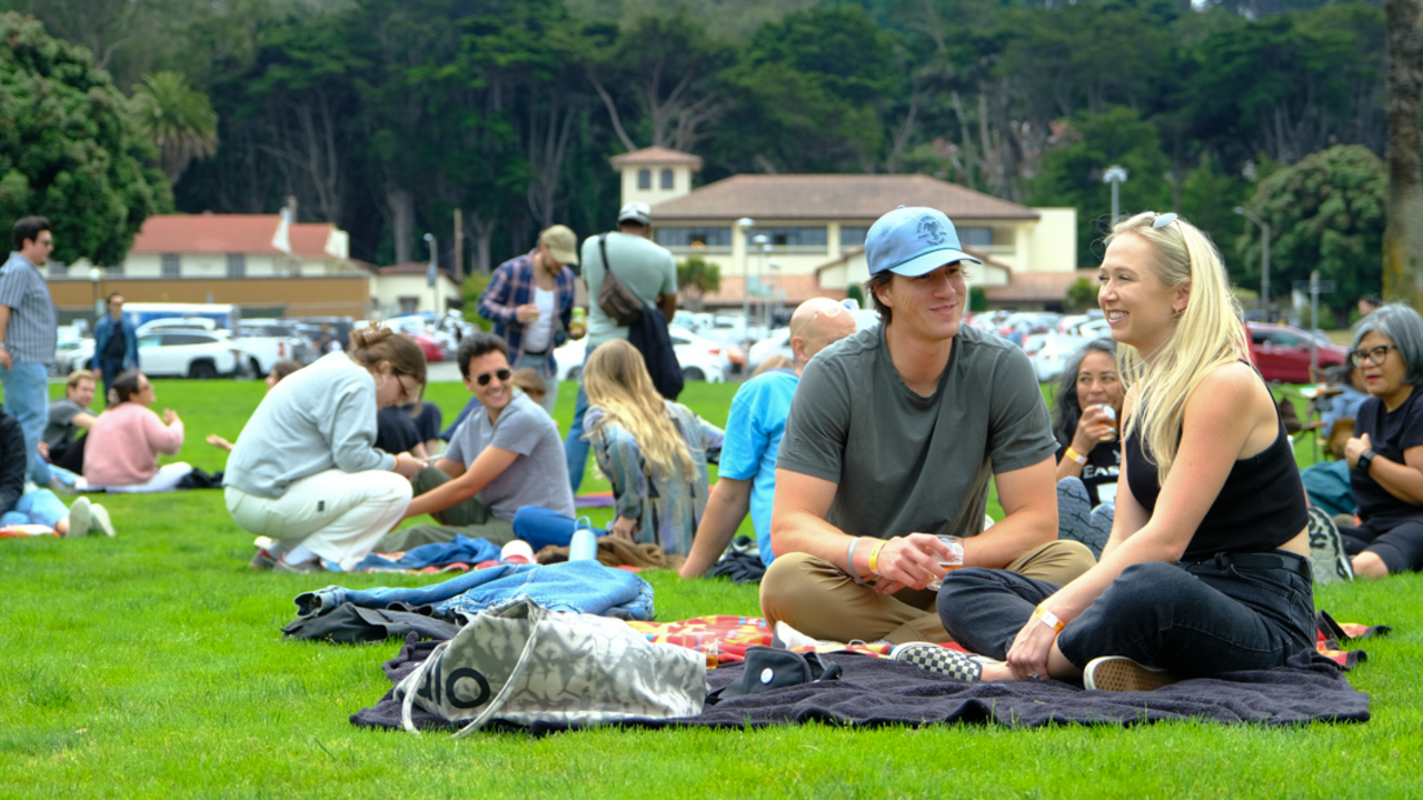 Parks4All: Brewfest patrons relaxing on picnic blankets on the Presidio lawn in San Francisco