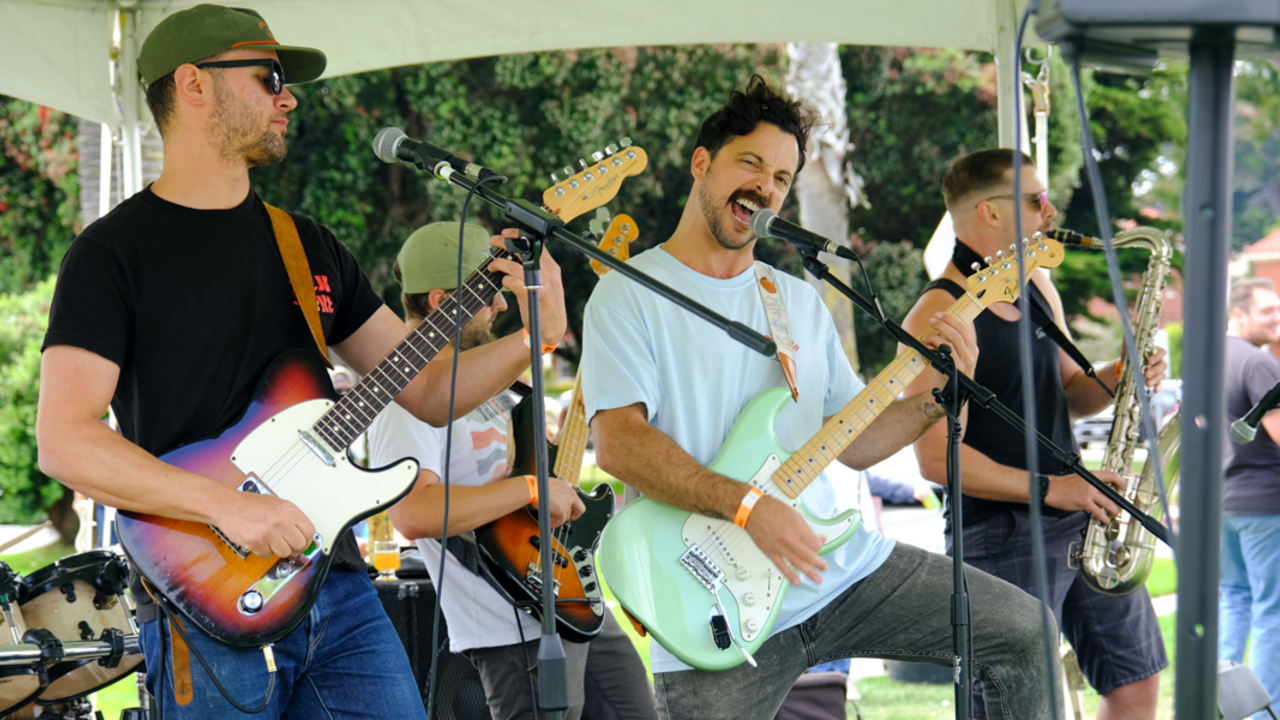 A live band performs for the crowds at Parks4All:Brewfest in the Presidio of San Francisco.