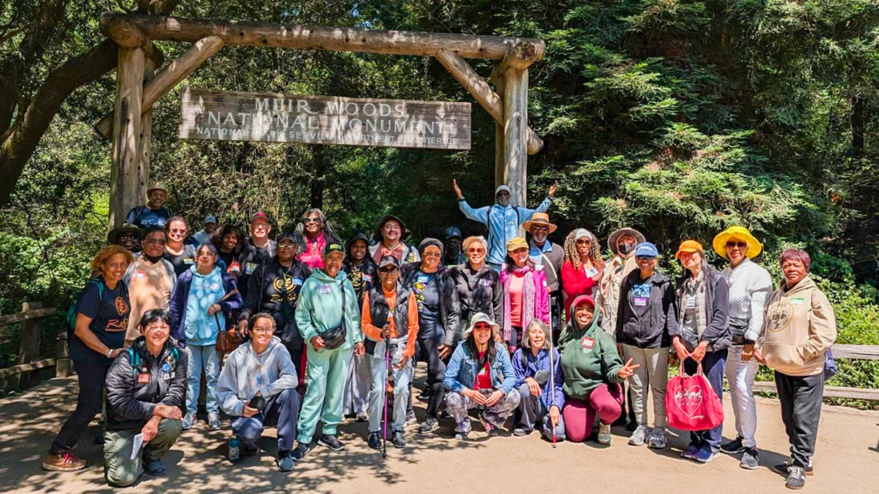The Rafiki Coalition community group poses for a group photo at Muir Woods National Monument in the San Francisco Bay Area.
