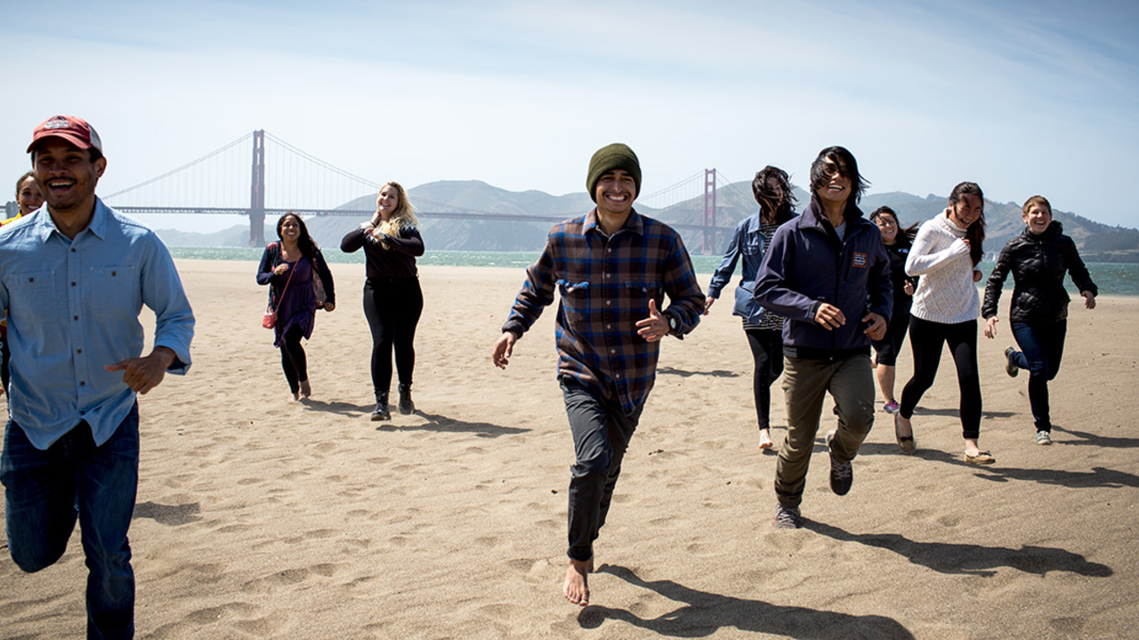 People running at East Beach near Crissy Field.