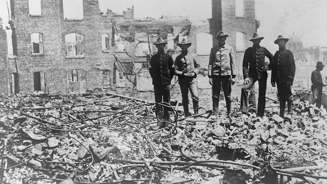 Soldiers in San Francisco stand amongst ruins and rubble after the 1906 earthquake 