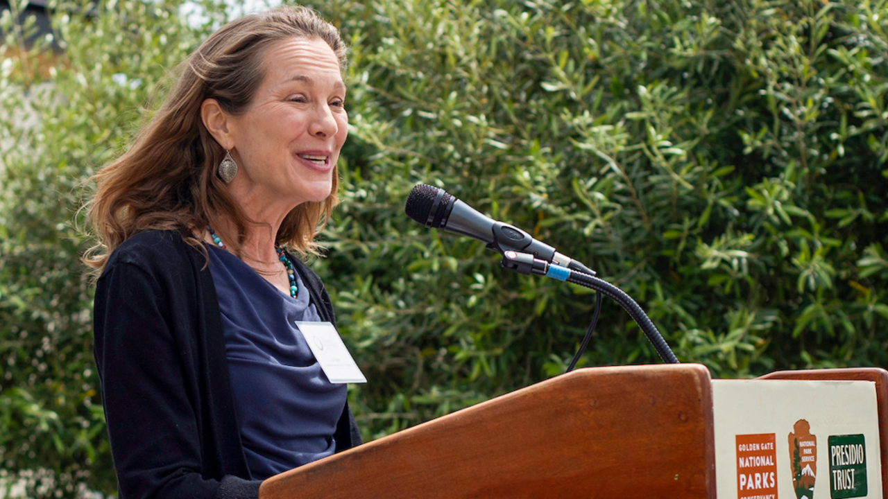 A woman speaks at the podium during Crissy Field Center's Goldman Prize Awards Youth Reception.