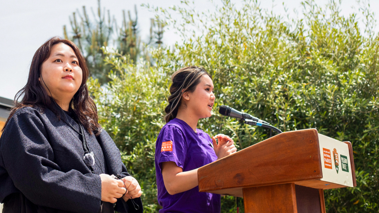 Two youth program participants speak at a podium during the Crissy Field Center's Goldman Prize Awards Youth Reception.