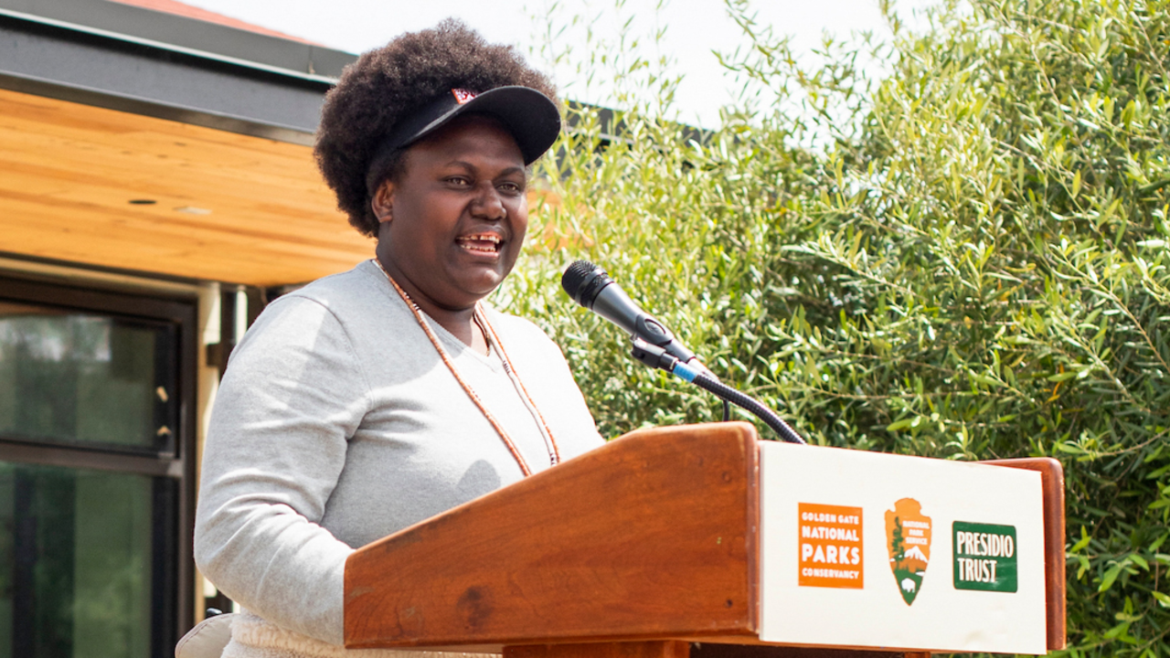 A woman speaks at the podium during Crissy Field Center's Goldman Prize Awards Youth Reception.