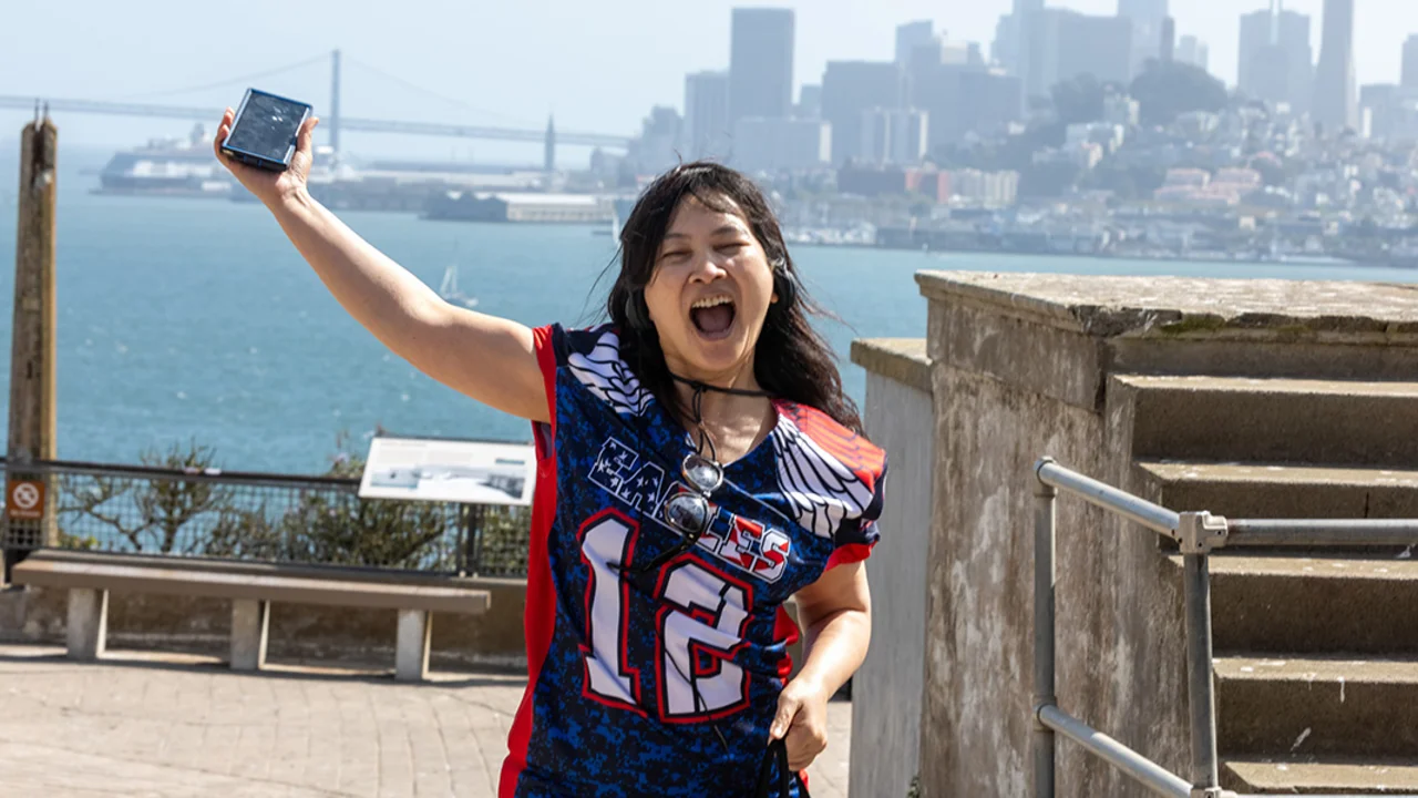 A visitor excited about being on Alcatraz Island.